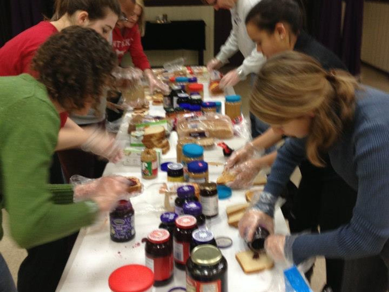 Community members receiving food during an outreach event