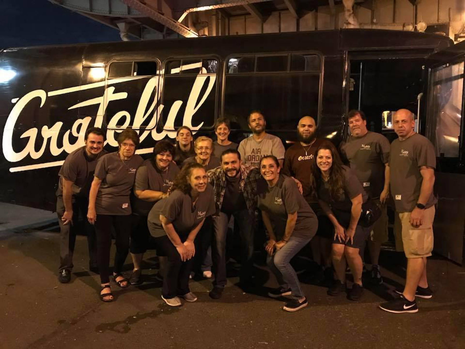 Outreach team gathered in front of the Grateful bus